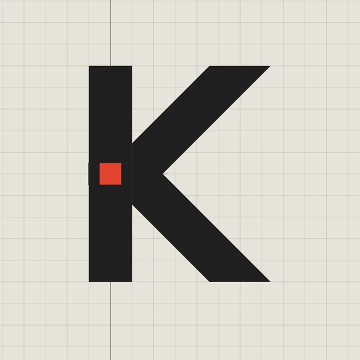 The finished mark: a graphite K with the tenon’s end shown as a red square.